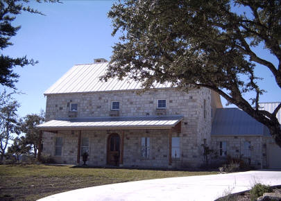 German style farmhouse Fredericksburg Texas - Hill Country heritage architecture - Riverside Home Designs