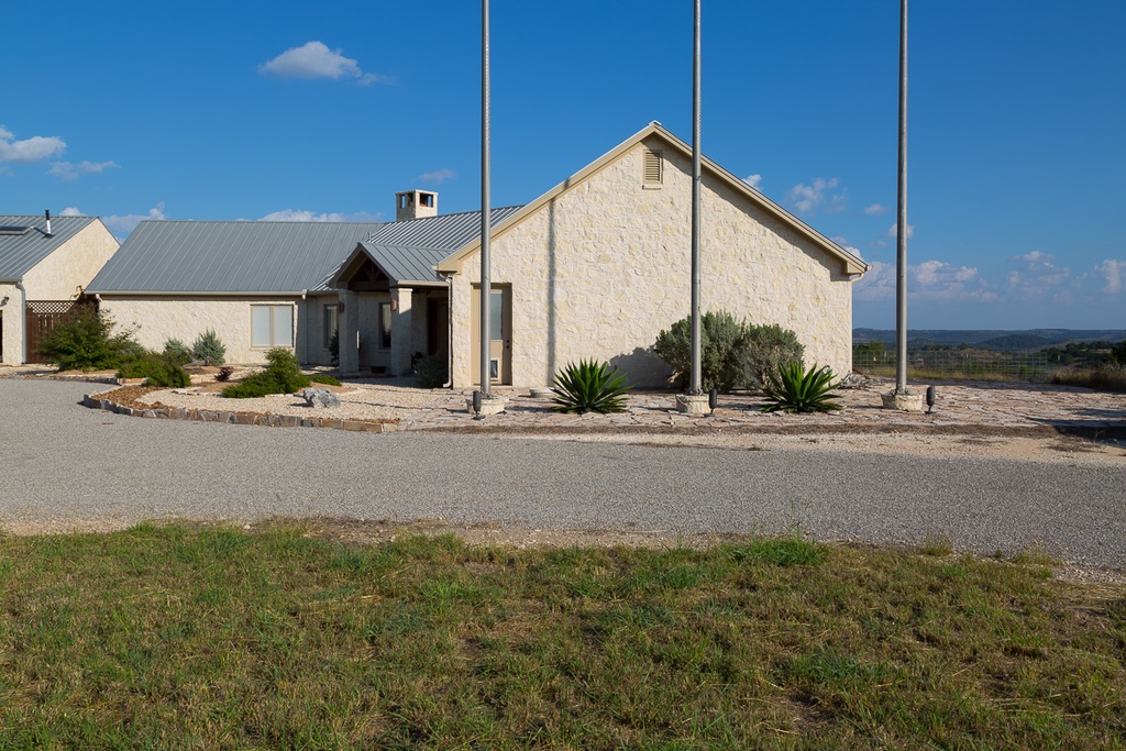 SIP framed home driveway view with angled design Riverside Home Designs - Riverside Home Designs Custom Home Portfolio