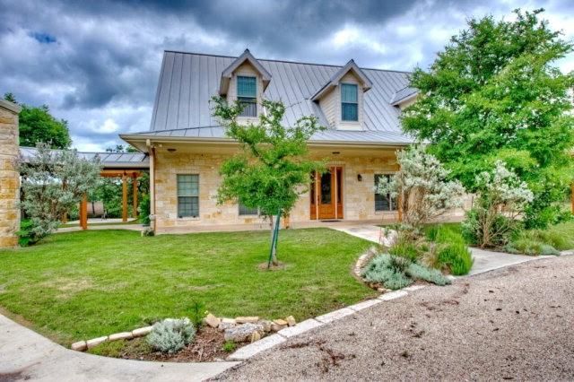 Kitchen with island and open living area - Riverside Home Designs Custom Home Portfolio