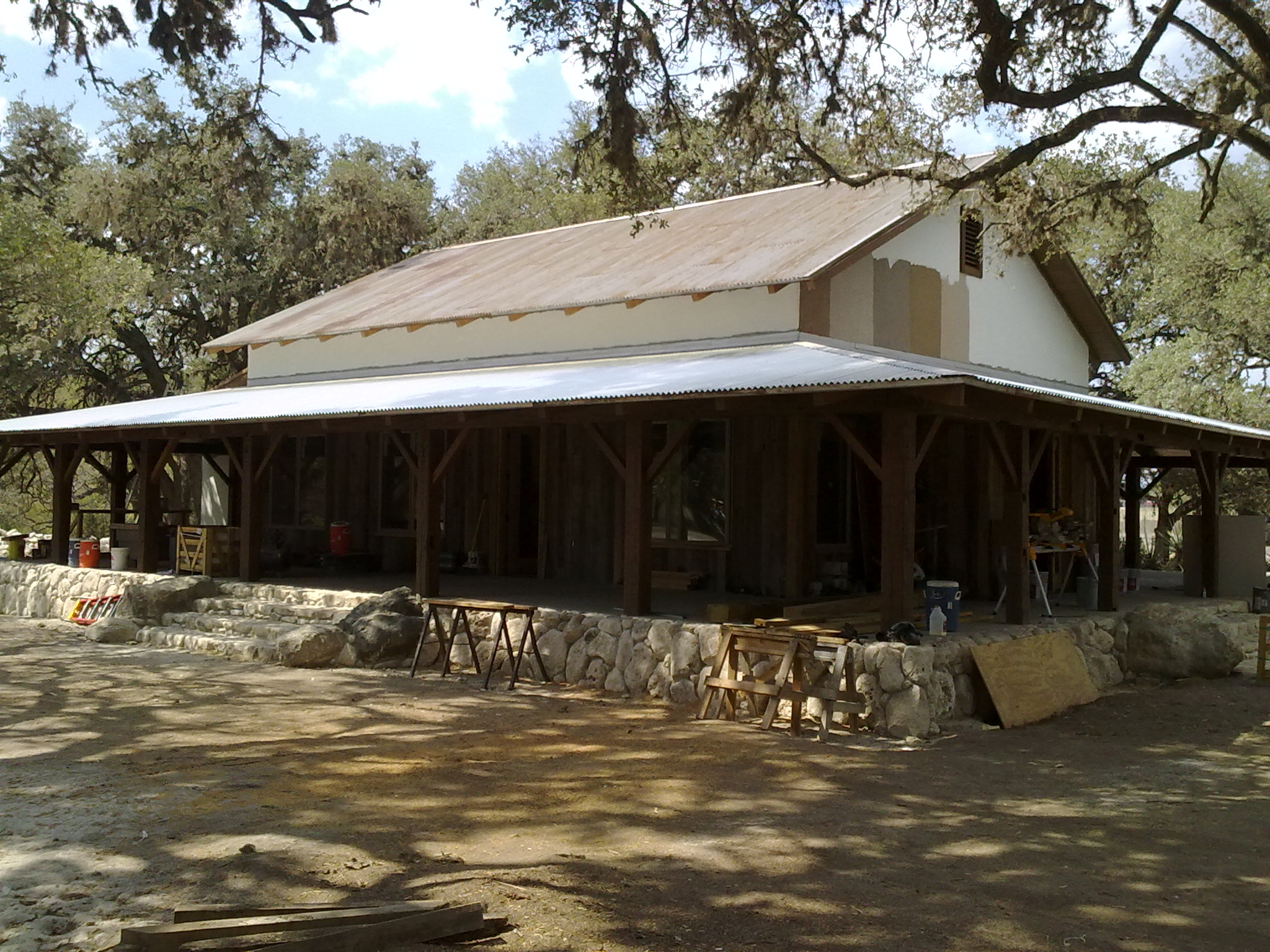 Farmhouse with Wrap Around Porch - traditional Hill Country home with expansive outdoor living porch - Riverside Home Designs Custom Home Portfolio