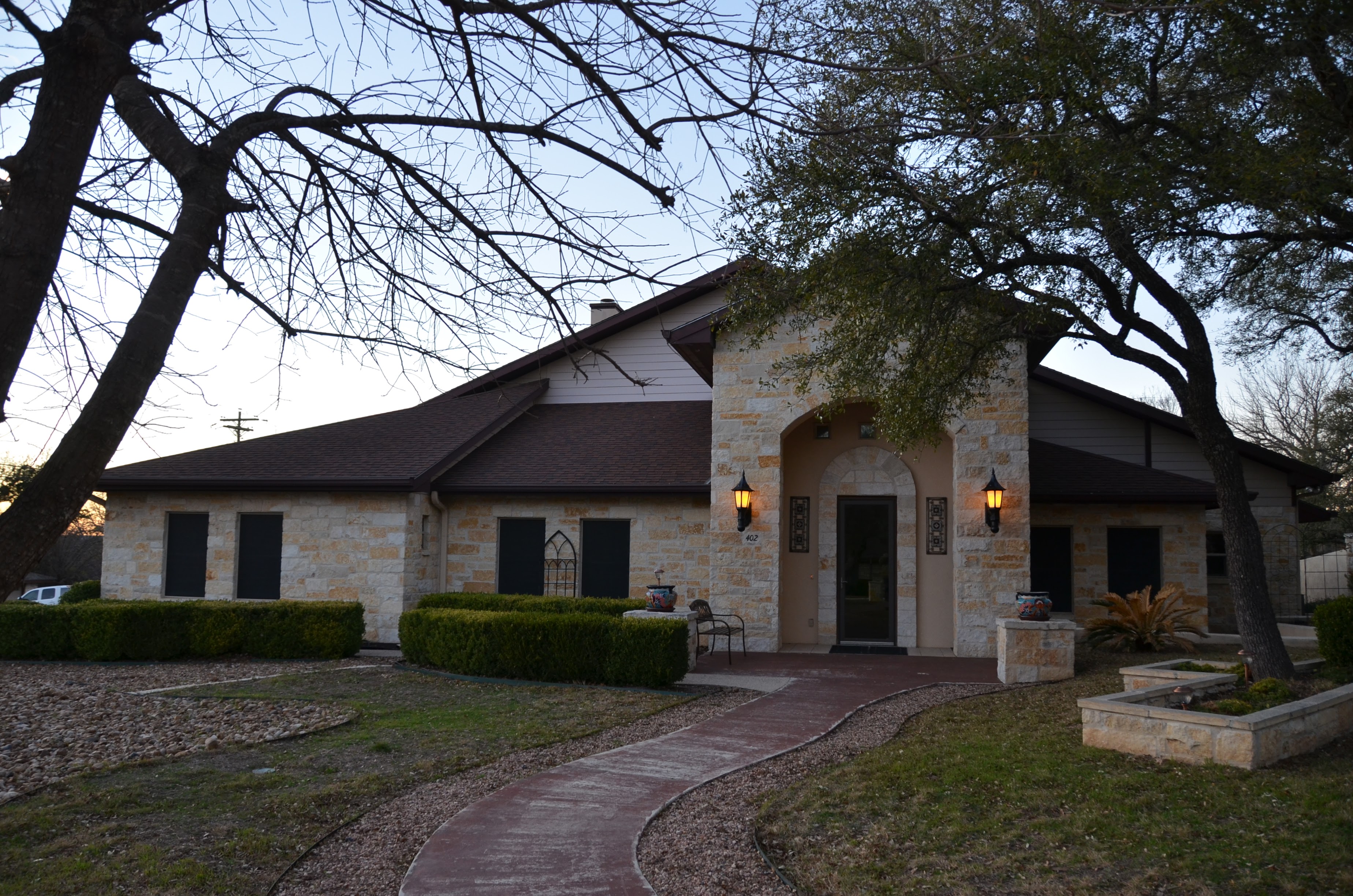 Timeless Stonework Meets Hill Country - home featuring traditional stone construction and classic Hill Country architecture - Riverside Home Designs Custom Home Portfolio