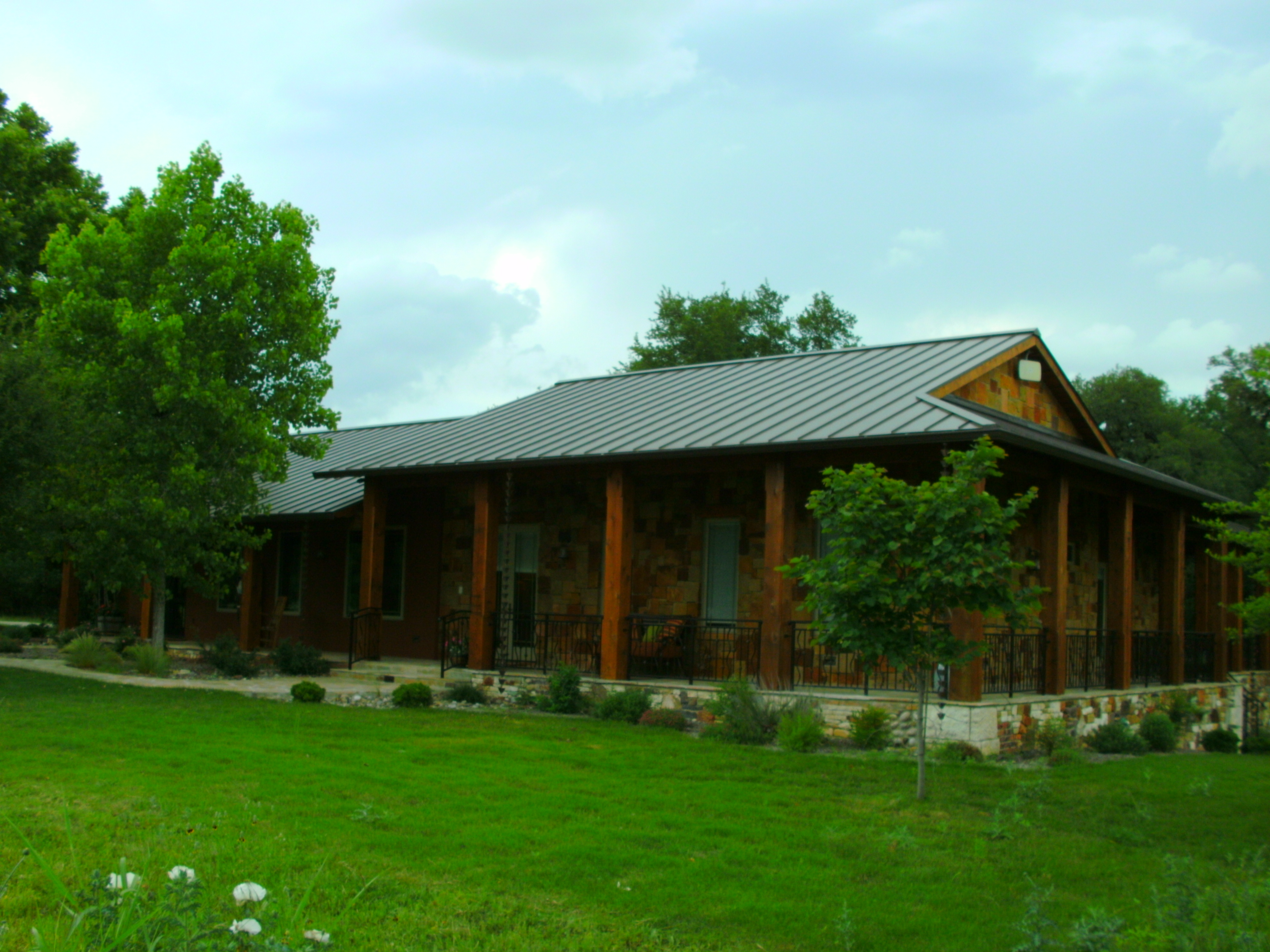 Rustic Home Living in Harmony With Nature - custom home designed to integrate with natural Hill Country environment - Riverside Home Designs Custom Home Portfolio